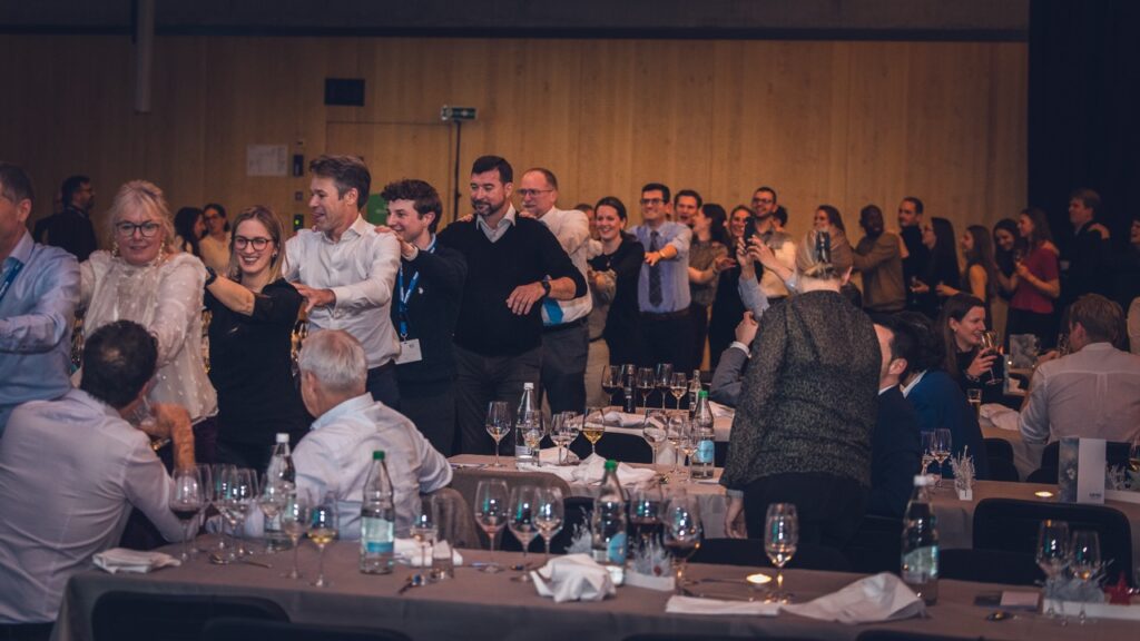 Guests celebrating in the hall at the Festive Evening